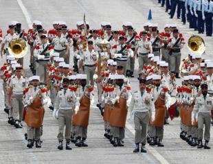 France celebrates national day as political crisis rumbles on