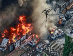 Bangladesh wakes to torched government buildings, internet blackout