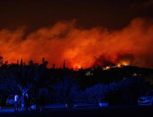 Residents flee as Greece wildfires rage despite superhuman efforts