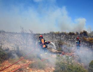 Firefighters calm deadly Athens inferno