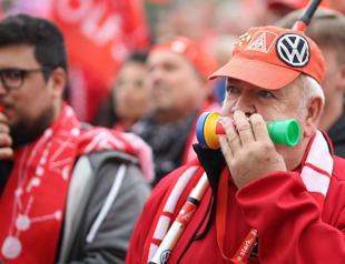 Crisis-hit German auto giant Volkswagen cuts forecasts