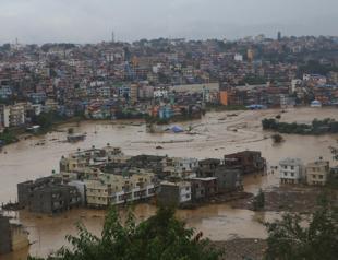 Nepal surveys flood wreckage as death toll reaches 198