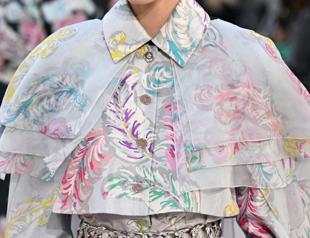 Feathers fly at Chanel as Vuitton packs in stars