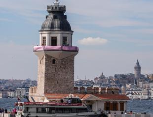 Maidens Tower adorned with pink ribbon for breast cancer awareness