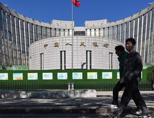 Chinas central bank cuts two key rates to boost economy