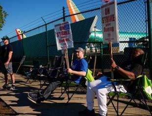 Boeing raises its offer to end strike, union to vote next week
