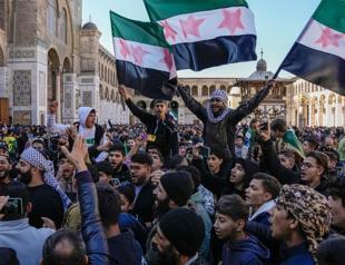 Syrians flood streets to celebrate end of Assad rule
