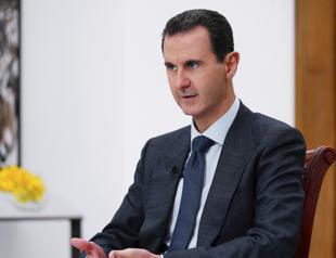 Assad says he had no plans to leave, but Russians evacuated him