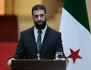 Syrias new leader says all weapons to come under state control