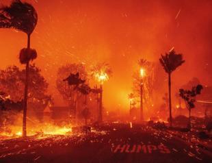 Wildfire sparks panicked evacuations in Los Angeles suburb