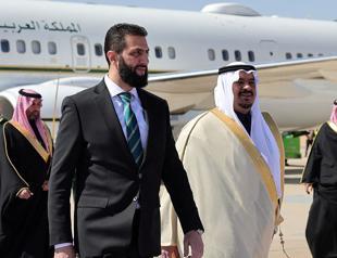 Syrias interim president makes 1st foreign visit to Saudi Arabia