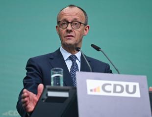 German vote winner Merz seeks to build govt as Europe waits