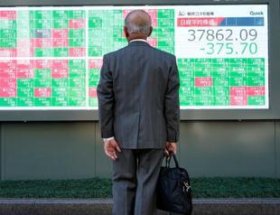 Stocks tank, gold hit new record high