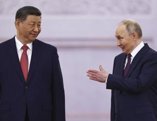Xi meets Putin in Moscow as Ukraine reports truce violations