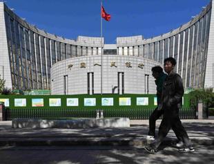 Chinas central bank cuts two key rates to historic lows