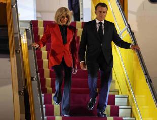 Macrons office downplays plane incident with wife
