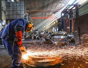 China factory output slumps in May as trade war pressures bit