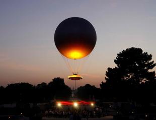 Paris iconic cauldron returns to light up summer nights