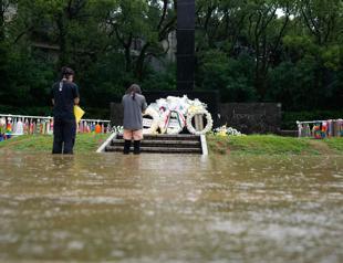 Japan urges evacuations after rains leave several missing