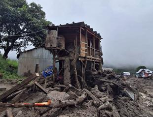 Indian rescuers scour debris after 60 killed in flood