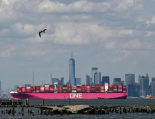 US trade gap widens more than expected on goods imports surge