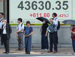 Asian shares rise after Japans prime minister resigns