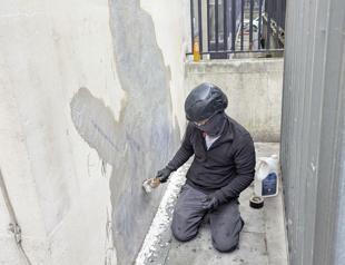 Banksy mural of a judge beating a protester scrubbed from London court