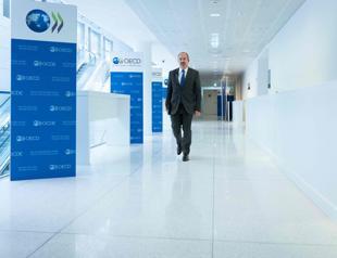 OECD ups world economic outlook as tariffs contained, for now