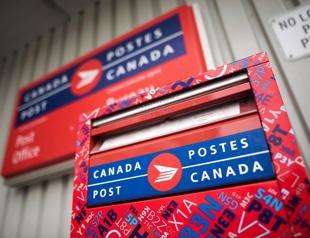 Bleeding money, Canada mail system slashes home delivery