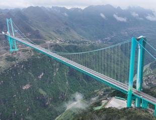 Worlds highest bridge opens to traffic in China