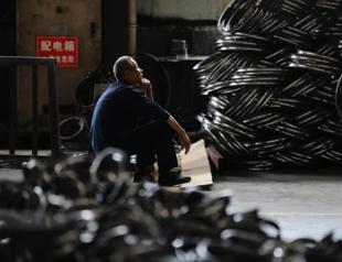Chinas factory activity shrinks again as trade tensions bite
