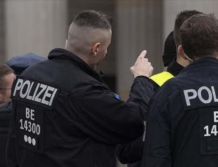 German police mobilize as blasts heard in burning house