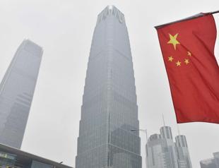 China urges equal dialogue with US as Apples Cook visits