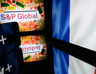Credit downgrade underscores budget push: French minister