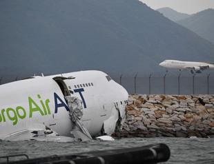 Cargo plane skids off Hong Kong runway, kills two
