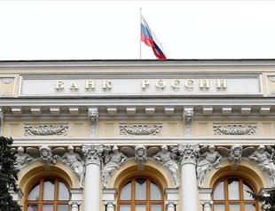 Russia cuts key interest rate, warns of tepid growth