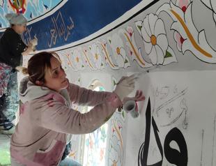 Women decorate mosque walls with intricate motifs