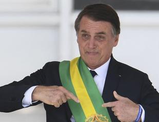 Brazils Bolsonaro begins 27-year jail term for coup bid