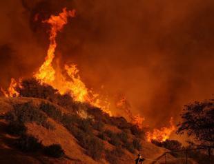 NASA reports record heat but omits reference to climate change