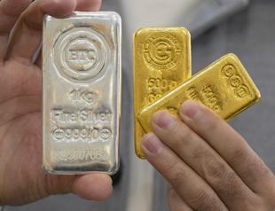 Equities sink, gold and silver hit records as Greenland fears mount