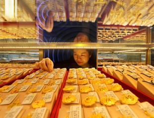 Dollar sinks on yen intervention talk, gold breaks $5,100