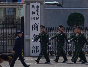 China acts against Japanese companies over military ties