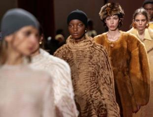 Milan runways highlight faux fur, backless designs, frayed fabrics