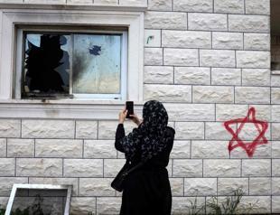 Israeli settlers burn buildings in attacks on West Bank villages