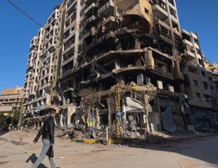 Israel pounds south Beirut, says captured Hezbollah members