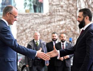 Germany tries to play down row over Syria refugee return