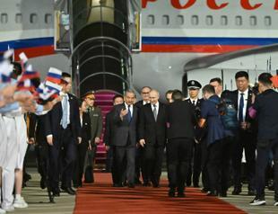 Putin lands in Beijing for talks with Xi