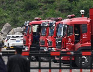 China rescuers search for missing after mine blast kills 82
