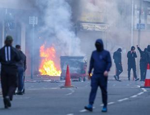Protesters torch buildings and vehicles, block roads over Belfast stabbing