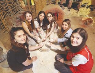 Students put away their phones to experience life 8,200 years ago